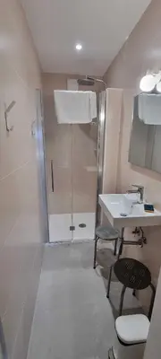 a bathroom with a shower and a sink at Maison de standing avec piscine vue mer Corse du sud Pozzaccio, Portigliolo 2 à 6 personnes 3 chambres in Coti-Chiavari
