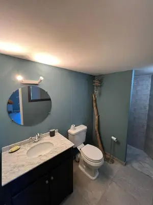 a bathroom with a toilet and a sink and a shower at Maison à 50 m de la plage, 10 personnes, 5 chambres en corse du sud, in Coti-Chiavari