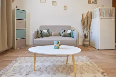 a living room with a coffee table and a couch at Coquet T2 pres des plages in Propriano