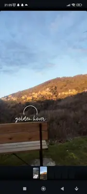 a view of a mountain with the sun setting in the distance at Maison typique de village Corse , 10 min aéroport et de la mer in Prunelli-di-Casacconi