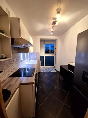 a kitchen with a sink and a counter top at Appartement Ajaccio vue mer in Ajaccio