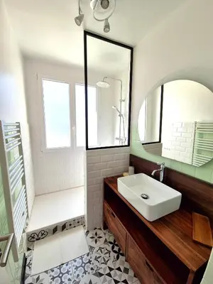 a bathroom with a sink and a mirror at Appartement Ajaccio vue mer in Ajaccio