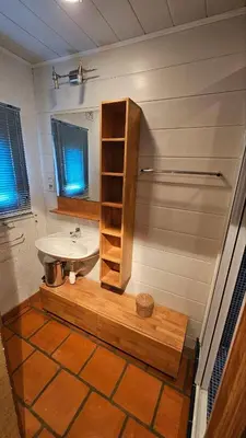 a bathroom with a sink and a mirror at House between the sea and the mountain in San-Giovanni-di-Moriani