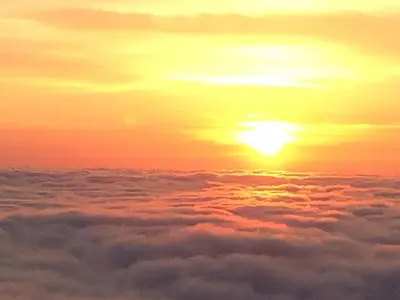 an image of a sunset above the clouds at House between the sea and the mountain in San-Giovanni-di-Moriani