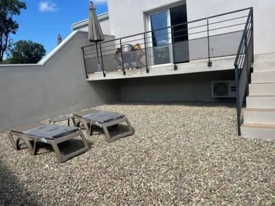 two dogs standing on the balcony of a house at E casette in Oletta