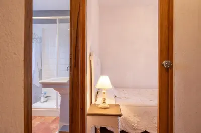 a bedroom with a bed and a lamp on a table at Casa Pruno in Pruno