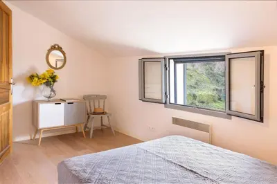 a bedroom with a bed and a window at Casa Pruno in Pruno