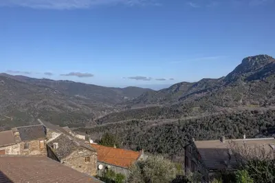 a view of a village with mountains in the background at Casa Pruno in Pruno