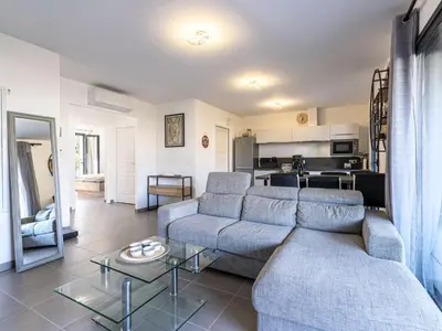 a living room with a couch and a table at Apartment Foce Dell Edera-2 by Interhome in Bonifacio