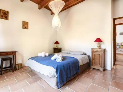 a bedroom with a bed with blue sheets and towels at Holiday Home Casa Gialla by Interhome in Arraggio