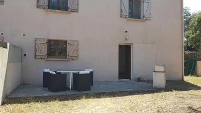 a building with a table in front of it at Gite de 90m2 proche de la mer avec grande piscine MONTI in Canale-di-Verde