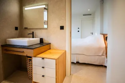 a bathroom with a sink and a bed at luxury villa les Kiks 5 chambres, piscine chauffée, Lecci in Lecci