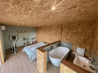 a bathroom with a bath tub and a sink at Villa Cala d Oro Vue mer Piscine et Crique privée in Sari Solenzara