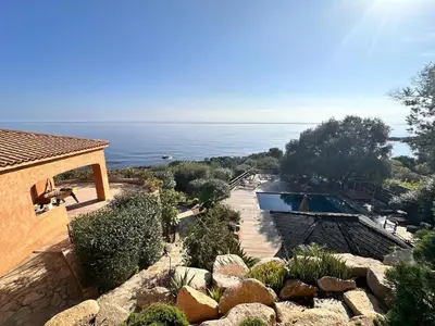 an aerial view of a house with a swimming pool at Villa Cala d Oro Vue mer Piscine et Crique privée in Sari Solenzara