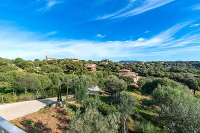 an aerial view of a house on a hill with trees at Villa Ondella - Villa entre plages et sentiers in Pianottoli-Caldarello