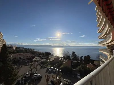a view of the ocean from the balcony of a building at Studio vue mer le Neptune sanguinaires Ajaccio in Ajaccio