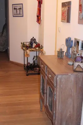 a room with a wooden dresser in a room at Appartement Vezzani Centre Corse in Vezzani