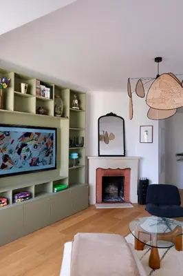 a living room with a television and a fireplace at Magnifique T3 de 85m2 de standing vue mer trottel in Ajaccio