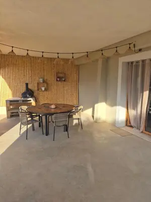 a dining room with a wooden table and chairs at CasaKia in Pietralba