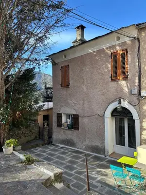 a house with a patio in front of it at Charming village house in Cambia
