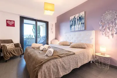 a bedroom with a dog laying on a bed at Clos Vignola - Domaine de la Viva -Superbe vue mer in Grosseto-Prugna