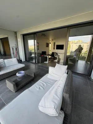 a living room with two couches and a couch at Luxury residence apartment with sea view, parking in Ajaccio