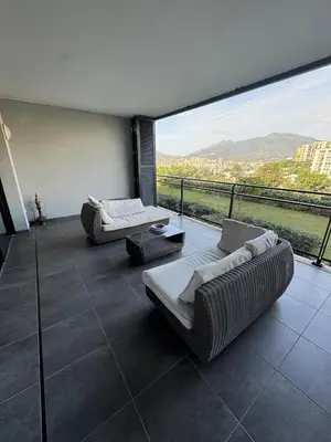 a living room with two couches and a large window at Luxury residence apartment with sea view, parking in Ajaccio