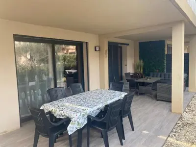 a table and chairs on a patio with a table and a table and chairsktop at villa jérémy in Bonifacio