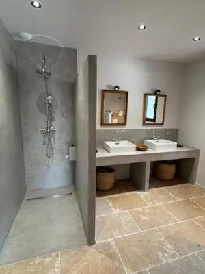 a bathroom with two sinks and two mirrors at casa di santa in Aléria