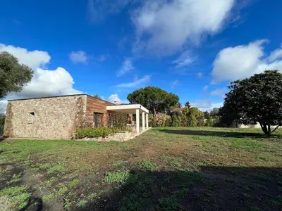 an old stone house with a large yard at casa di santa in Aléria