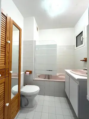 a bathroom with a toilet and a sink and a tub at Superbe Studio pieds dans l'eau - Parking gratuit - Terrasse - Emplacement idéal dans résidence de standing in Ajaccio