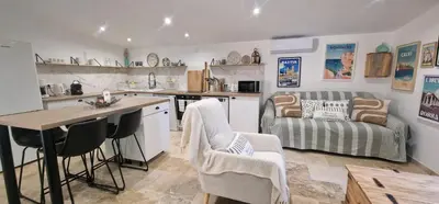 a kitchen with a table and chairs and a couch at Stalla in Ortiporio