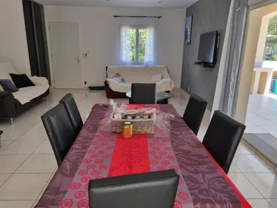 a dining room with a table and chairs at Villa Stellalilou in Porto-Vecchio
