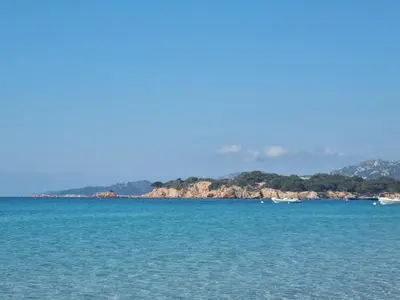 a view of the ocean with boats in the water at Villa Stellalilou in Porto-Vecchio
