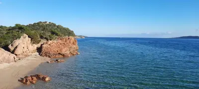 a group of people laying in the water on a beach at Villa Stellalilou in Porto-Vecchio