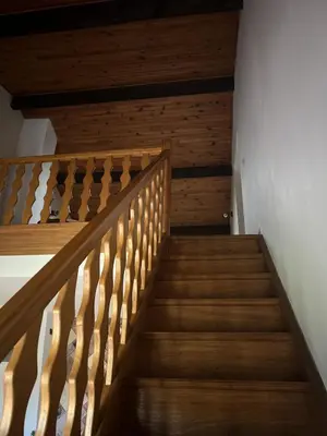 a staircase in a house with wood paneling at Villa Santa Rita in Lucciana