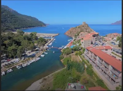 an aerial view of a river with a resort at Résidence Hotelière Capu Seninu in Porto Ota