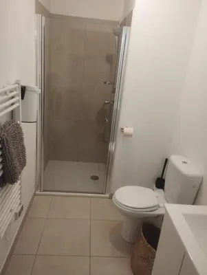 a bathroom with a shower with a toilet and a sink at T2 Waterfront Linguizzetta in Linguizzetta