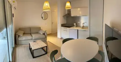 a small living room with a table and a couch at T2 Waterfront Linguizzetta in Linguizzetta