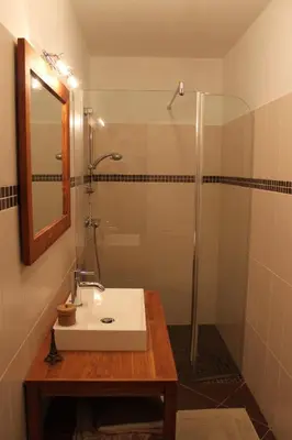 a bathroom with a sink and a shower at Quenza-Alta Rocca in Quenza