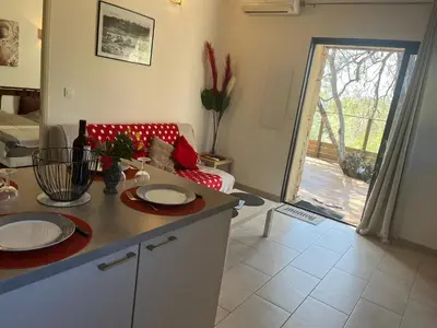 a living room with a table with plates on it at Les Bergeries de Petralonga in Sotta