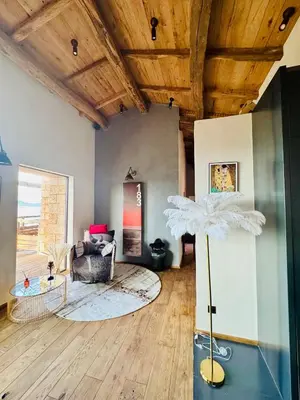 a living room with a couch and a wooden ceiling at Terradigaya in Pietrosella