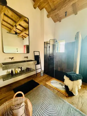 a bathroom with a shower and a sink and a mirror at Terradigaya in Pietrosella