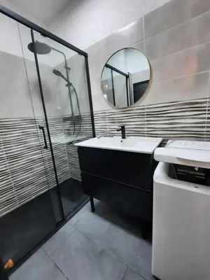 a bathroom with a sink and a mirror at Studio vue mer Sanguinaires 3 minutes des plages in Ajaccio
