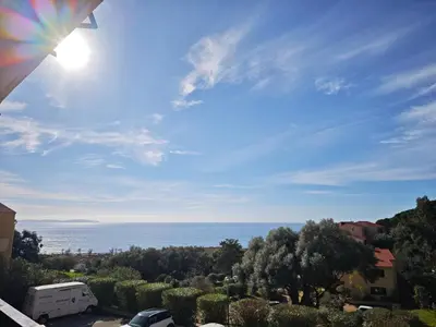 a view of the ocean from a balcony at Studio vue mer Sanguinaires 3 minutes des plages in Ajaccio