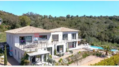 an aerial view of a house with a swimming pool at Santa Giulia Camara - Lecci Lodge in Lecci