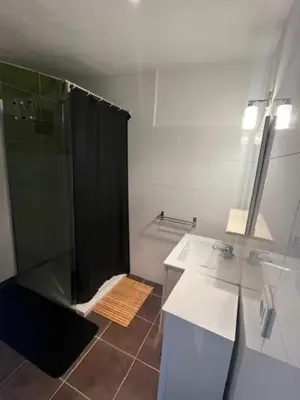 a bathroom with a shower and a sink at Maison individuelle type F2 in Alata