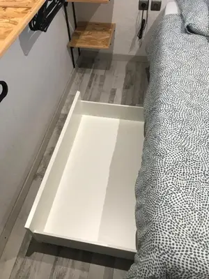a white floor in a room with a bed at L'Attellu di Babbu in Lecci