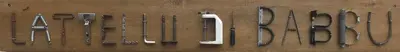 a row of utensils lined up on a wall at L'Attellu di Babbu in Lecci