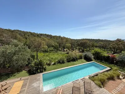 an overhead view of a swimming pool in a garden at Palombaggia Camara - Lecci Lodge in Lecci